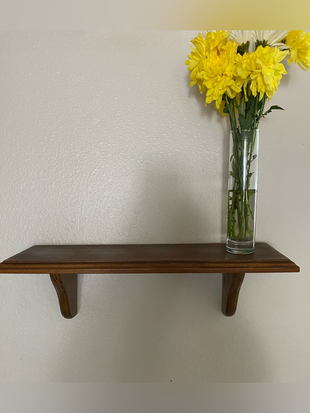 Vintage brown oak wall shelf with beveled edges and decorative dual brackets